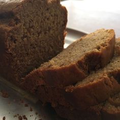 sliced loaf of banana bread sitting on top of a cutting board