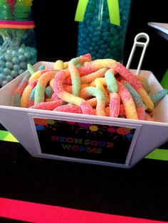 a box filled with lots of candy sitting on top of a table