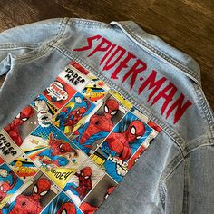 Looking for the perfect denim jacket? Look no further! Our Marvel Spider-Man Denim Jacket is the ultimate choice for any occasion, whether it's a night out or a casual day out. The wash off varies and unique fabric prints, these jackets are true to size and can also be worn as an oversized fit if you size up. For example, if your child wears a true size 3t, the 3t-4t option will fit perfectly oversized, but the 3t-4t size will also provide a perfect fit for regular wear. Say goodbye to uncomfort Spiderman Denim Jacket, Spiderman Costume For Boys, Different Clothes Styles, Spider Man Clothes, Unique Fabric Prints, Spiderman Jacket, Graphic Jacket, Spiderman Gifts, Estilo Hipster