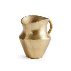 a gold colored vase on a white background