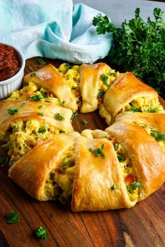 an omelet is cut into pieces on a cutting board