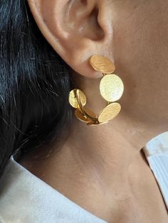 For all hoop lovers, One of a kind designer piece by SHIVKA. Simply Stylish and Elegant! A gorgeous pair of hoop studs. Purely handmade with love by our skilled Indian craftsmen from Jaipur  Handcrafted in brass with a textured gold-plated base. This designer jewelry piece can go well with both Indian and western wear. Dimensions: Weight per Pair: 16 grams Drop Length: 4 cm Width:  3.5 cm Closure Type: Push Back Closure Elegant Handmade Semi-circle Earrings, Handmade Hoop Earrings For Anniversary, Modern Handmade Hoop Earrings For Anniversary, Handmade Modern Hoop Earrings For Anniversary, Unique Handmade Hoop Earrings For Wedding, Gold Texture, Jewelry Earrings Hoops, Designer Jewelry, Western Wear