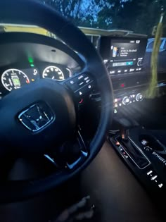 the interior of a car with dashboard lights and gauges