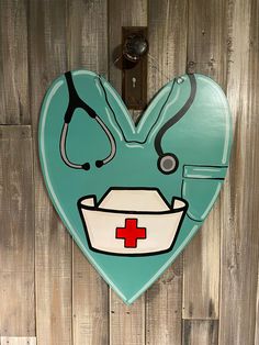 a heart shaped sign with a nurse's hat and stethoscope on it