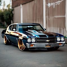 a black and gold muscle car parked in front of a building