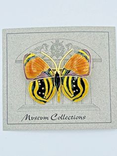 This beautiful butterfly brooch was hand fabricated 40+ years ago using 925 sterling silver for the base metal, 18K gold plating and hand-painted with glass enamel. The images do not accurately show the vibrant and glossy enamel colors but I want to assure you they are lovely in person. You can tell by looking at the back of the brooch that the wings of the butterfly are domed and dimensional. When you look closely at the images, you will notice the fine hand fabrication of this brooch. The company that made this item is well known for manufacturing detailed & authentic replicas of jewelry found in museums. I was lucky enough to purchase a large sample case filled with their jewelry that had been locked away for 30+ years. The condition of this appears to be almost new and the enamel is in Yellow Enamel Brooches For Gifts, Gold Butterfly Brooches For Collectors, Handmade Gold Enamel Pin, Multicolor Butterfly Brooches As Gift, Gold Butterfly Brooch Gift, Gold Butterfly Brooch As Gift, Gold Butterfly Brooches For Gift, Gold Butterfly Brooch For Gift, Butterfly-shaped Enamel Pin Gift