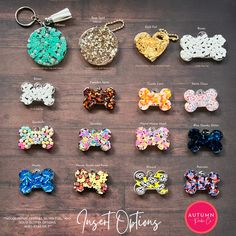 a bunch of different colored bows on top of a wooden table next to a keychain