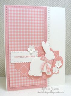 a close up of a card with a bunny on the front and pink gingham background