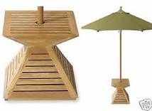 an umbrella and stand made out of wood