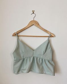 Hand made peplum tank top in Mint. This specific tank top has been made with thrifted fabric so It is sustainable and ethically made.  This Tank top fits S/M Cotton Ruffle Cami Tank Top, Cotton Ruffled Tank Top, Chic Sleeveless Cotton Peplum Top, Cotton Peplum Tops, Summer Cotton Peplum Top, Fitted Cotton Peplum Top For Summer, Fitted Peplum Tank Top For Spring, Tank Top Fits, Peplum Tank Top