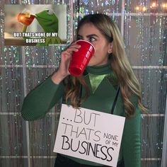 a woman holding a red coffee mug in front of her face with the words but that's none of my business on it