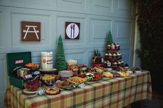 a table topped with lots of food next to a garage door