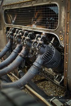 the inside of an old car with metal pipes