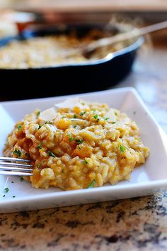 a white plate topped with macaroni and cheese