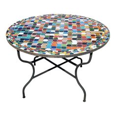 a multicolored mosaic table with black metal legs