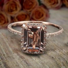 A perfect handmade Limited Time Sale: 1.75 Carat Peach Pink 7x5mm Emerald Cut Morganite Diamond Moissanite Engagement Ring with 18k Gold Plating in 925 Silver with Rose Gold Plating. Peach Pink Morganite is true of character, the vibrant hues reminiscent of the radiant sunset.Inspired by the true harmony of love, the delicate design of the Engagement Ring in 925 Silver with Rose Gold Plating has been enriched with glittering moissanite Diamond Moissanite for added delight and brilliance. A beaut Morganite Diamond Engagement Ring, Engagement Ring Mountings, Pink Emerald, Moissanite Engagement Ring Halo, Morganite Diamond, Ringe Gold, Pink Morganite, Halo Diamond Engagement Ring, Peach Pink