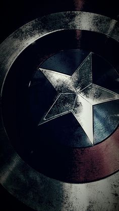 the captain's shield has a silver star on it