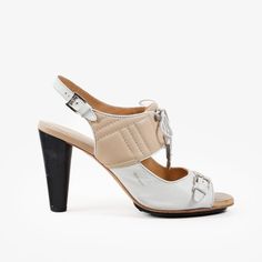 Perfect For A Summer's Night Out, These Sandals From Tod's Features A Features A Sophisticated Design That Combines Style And Comfort. The Shoe Boasts A Mix Of Beige And White Leather, Creating A Chic, Two-Tone Effect. The Upper Part Includes Detailed Stitching, Adding A Touch Of Refinement. A Lace-Up Front With Silver-Tone Aglets And A Matching Silver Buckle On The Toe Strap Enhances The Overall Aesthetic. The Adjustable Ankle Strap Ensures A Secure Fit, While The High Cone Heel Adds A Touch Of Sophistication, Making These Sandals Perfect For Both Casual And Formal Occasions. Size: 41 It Condition: Good; Marks, Scuffs, And Creasing Present Throughout Both Heels On The Upper, Insole, And O Designer Slingback Sandals With Padded Heel For Summer, Designer Summer Slingback Sandals With Padded Heel, White Open Toe Heels With Leather Sole, White Leather Slingback Sandals For Party, Modern White Sandals With Reinforced Heel, Designer High Heel Slingback Sandals For Summer, Designer Spring Slingback Sandals With High Heel, White Leather Sole Heels For Summer, White Sandals With Leather Sole And Block Heel