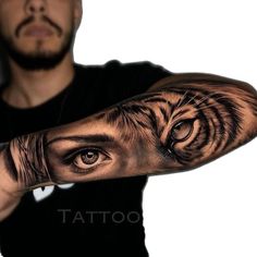 a man's arm with an eye and tiger tattoo on the left side of his arm