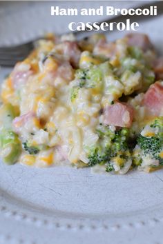 ham and broccoli casserole on a white plate with a silver fork