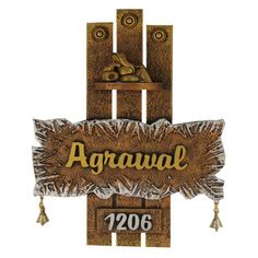 a wooden sign that says agraval on it's side and is hanging from the wall