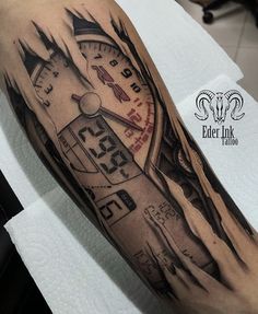 a man's arm with a clock tattoo on it