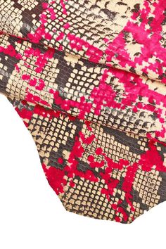 a close up of a tie with pink and black designs on it's side