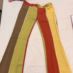 Alice + Olivia Flare Leg Low Rise Block Colored Pants. Size 4, Brown, Green, Yellow, And Red With Cream Lace Stitching. They Are Pre-Owned But Look Fabulous. They Have A Vintage 70’s Style To Them And Look Amazing On. They Are 100% Cotton Material. 70’s Style, Retro Pants, Yellow Pants, Clothes Sewing Patterns, Colored Pants, Cream Lace, Alice Olivia, Beautiful Things, Green Yellow