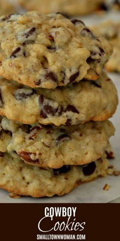 three cookies stacked on top of each other with the words cowboy cookies written below them