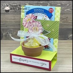 a card with a flower in a bowl on it