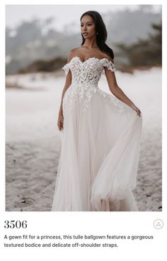 a woman in a white dress standing on the beach wearing an off - shoulder gown