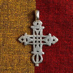 Ethiopian cross pendant orthodox church neck cross pendant African beads handmade in Ethiopia. Made of solid brass.  Well made neck cross by Ethiopian silversmiths using lost wax method and hand engraved to give it a final touch.  60 x 45 mm.(HxW)  Please visit my shop for similar items and buy more and save more on shipping. Symbolic Engraved Cross Pendant Necklace, Traditional Silver Cross Necklace, Traditional Cross Necklace With Large Pendant, Traditional Cross Pendant Necklace With Large Pendant, Traditional Necklace With Large Cross Pendant, Traditional Silver Cross Necklace As Gift, Traditional Handmade Cross Necklace, Traditional Silver Cross Necklace Gift, Spiritual Pendant Cross Necklace