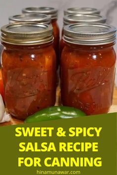 several jars filled with food sitting on top of a wooden cutting board next to garlic and peppers