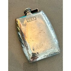 a flask shaped like a hip flask with the word one written on it