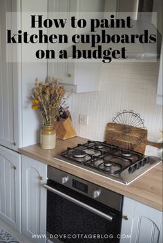 a stove top oven sitting inside of a kitchen next to a wooden cutting board with flowers on it