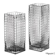 two clear glass vases sitting side by side on a white background, one is empty