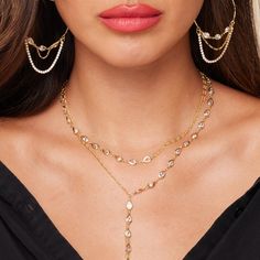 Mixed media makes major style. Our chain and CZ layer is one that you'll find a way to wear with everything. 14kt gold-plated chain measures 16”. Genuine CZ accents with mixed media chain. Gold Cubic Zirconia Chain Necklace For Party, Gold Jewelry With Pearl Chain And Cubic Zirconia, Gold Cubic Zirconia Jewelry With Pearl Chain, Gold Plated Layered Clavicle Necklace For Party, Party Gold Plated Layered Necklace With Clavicle Chain, Gold Cubic Zirconia Lariat Backdrop Necklace, Gold Plated Layered Necklace With Clavicle Chain For Party, Party Gold Plated Layered Necklace With Adjustable Chain, Gold Plated Clavicle Chain Layered Necklace For Party