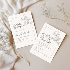 two wedding cards with flowers on them