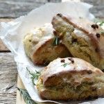 three scones sitting on top of a piece of wax paper