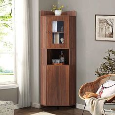 a living room with a chair and book shelf