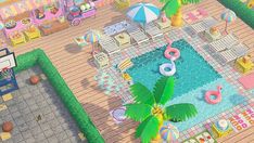 an aerial view of a pool with toys and palm trees