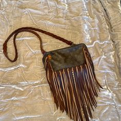 Vintage Boho Louis Vuitton Crossbody With Leather Strap. This Is In Great Condition. I Only Used It A Couple Of Times. The Inside Is Very Clean. Smoke Free House This Has Been Stored In Its Dust Bag. Boho Louis Vuitton Handbags, Louis Vuitton Western Purse, Louis Vuitton Fringe Crossbody Bag, Louis Vuitton Bag Fringe, Lv Western Purses, Brown Crossbody Shoulder Bag With Tassels, Louis Vuitton Crossbody, Bags Vintage, Louis Vuitton Color