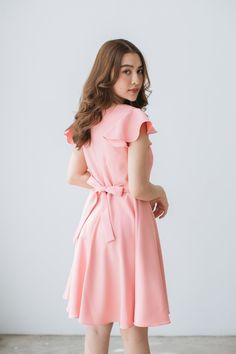 Pink A-line Midi Dress With Ruffles, Feminine Pink Knee-length Ruffle Dress, Elegant Pink Dress With Flutter Sleeves, Pink Elegant Short Sleeve Ruffle Dress, Elegant Pink Ruffle Dress With Short Sleeves, Feminine A-line Dresses With Ruffle Hem, Pink Fitted Dress With Flutter Sleeves, Pink Ruffled Knee-length Dress, Pink A-line Midi Dress With Ruffle Hem