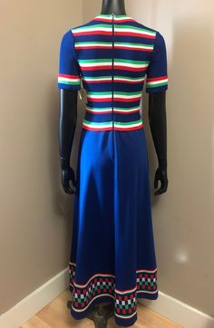 Vintage 1970s Giamo knits maxi dress striped ribbed knit bodice scoop neck collar short cuffed sleeves free flowing skirt back zip closure Circa 1970s Giamo Knits Made in the USA Primary Blue, Red, Green and White No Content Label Feels like Polyester Excellent Condition ✂----M e a s u r e m e n t s: all in inches. ⦿ Bust 28-34 ⦿ Waist 25-28 ⦿ Hips up to 42 ⦿ Length: 56 ⦿ Sleeve 10 All measurements are taken flat. ❉ this is a vintage item and there is ONLY one! Item no. GG998GN This garment has Color Block Maxi Dress, 70s Dress, Flowing Skirt, 60s Dress, Maxi Knit Dress, Orange Dress, Office Outfits, Striped Dress, Knit Dress