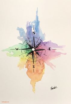 a watercolor drawing of a compass on white paper