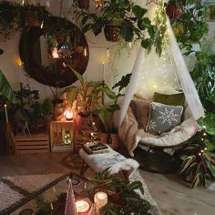 a living room filled with lots of plants and candles