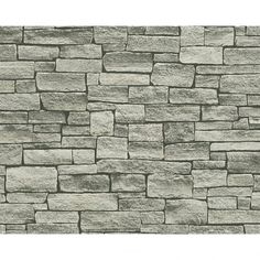 a stone wall that is grey and white