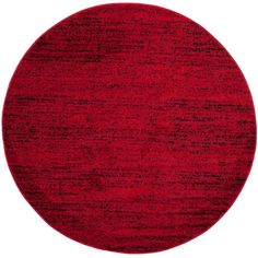 a round red rug on a white background