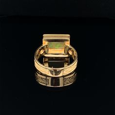 A bright and colorful 2.14 carat opal with an unusual rectangular cushion shape is featured in this handmade 18k yellow gold ring. The opal exhibits a variety of colors - predominately green, orange, yellow, and red, with subtle flashes of turquoise and purple. Set in an intricately engraved bezel and positioned to sit "east west" across the finger, this is a unique look that is both flattering and comfortable to wear. A round diamond accents each side of the center stone, adding extra sparkle a Yellow Gold Opal Ring With Cabochon, Rectangular Cabochon Gold Rings, Gold Rectangular Cabochon Rings, Rectangular Cabochon Yellow Gold Ring, Rectangular Gold Cabochon Rings, Vintage Yellow Gold Opal Cabochon Ring, Yellow Gold Cabochon Opal Ring, Cabochon Yellow Gold Opal Ring Collectible, Purple Set