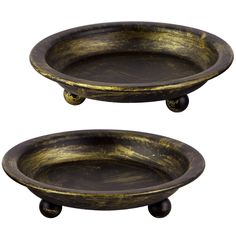 two black and gold trays with wheels on each side, one is holding an empty bowl